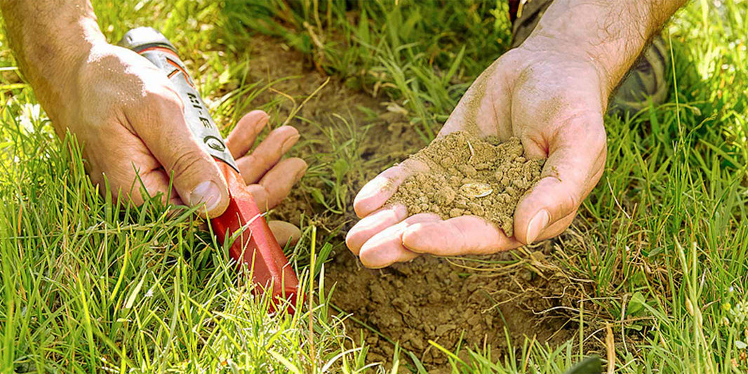 Detectorist holding an old dug coin before cleaning it