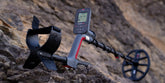 Minelab Vanquish 540 metal detector on rocky terrain