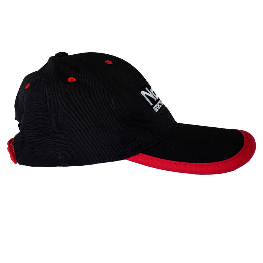 Close-up of embroidered Nokta logo on black metal detecting cap