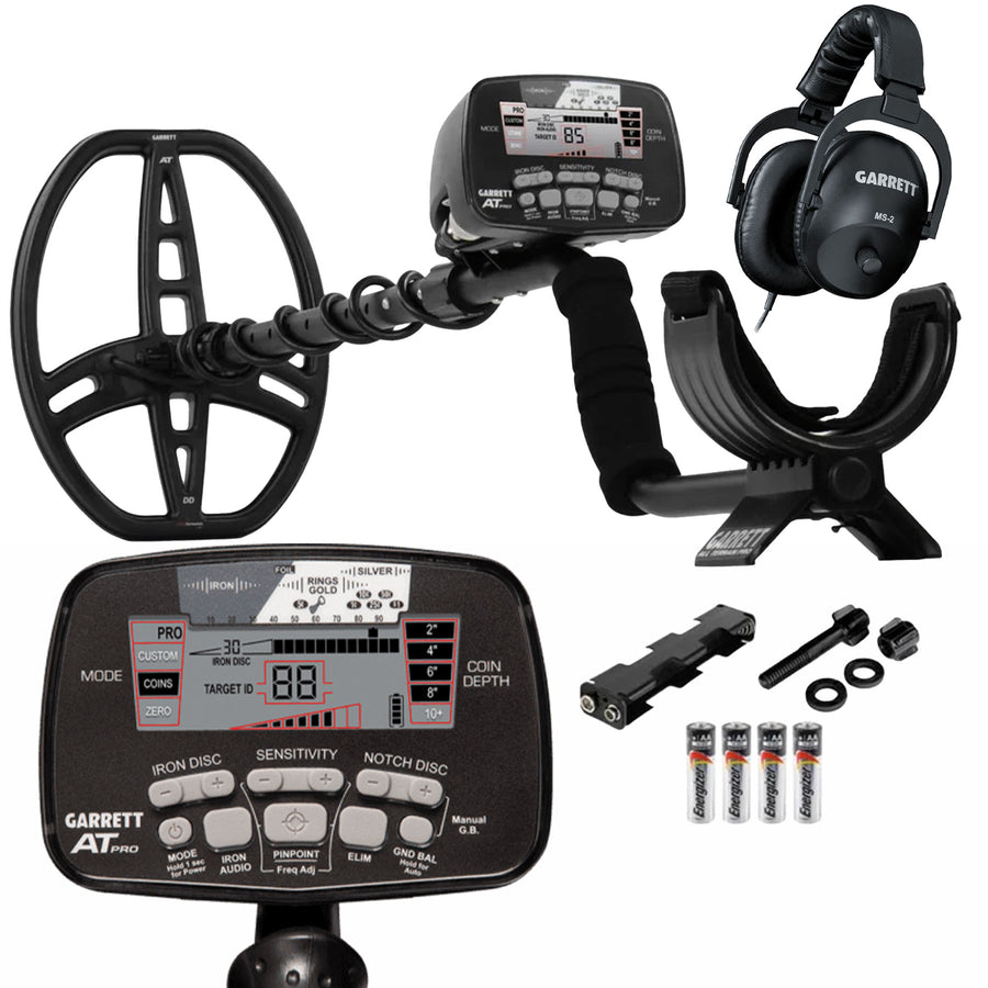 Black Garrett AT Pro metal detector with accessories on white background