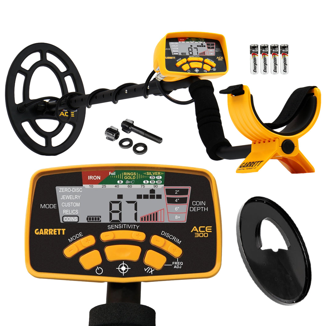 Yellow and black ACE 300 metal detector with control box, black coil cover, coil hardware, and batteries on white background
