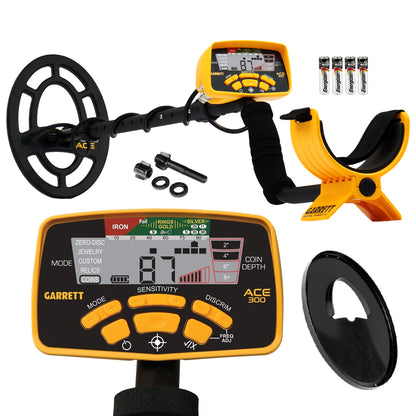 Yellow and black ACE 300 metal detector with control box, black coil cover, coil hardware, and batteries on white background