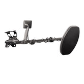 A black metal detector with a large coil, a textured handlebar grip, and a rectangular display screen, shown against a solid white background.
