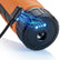 Close-up of an orange and black metal detector charger and charge hole and glowing blue electric effect graphics on a white background.