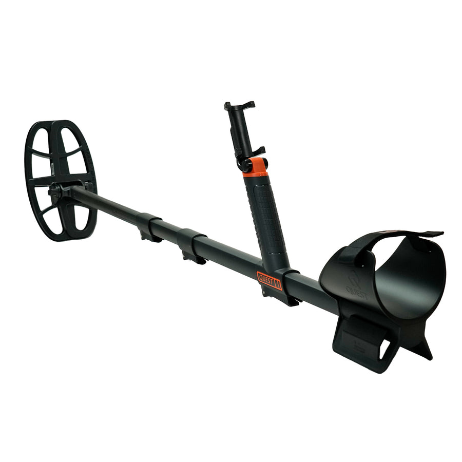 A black metal detector with a coil, adjustable handle, and mounting smartphone bracket, shown on a solid white background.