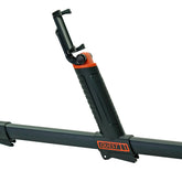 A close-up of a black and orange Quest mount with a phone holder attachment, shown on a white background.