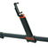 A close-up of a black and orange Quest mount with a phone holder attachment, shown on a white background.