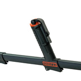 Close-up of a black and orange Quest metal detector handle with smart phone mount against a white background.