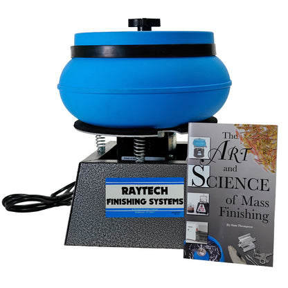 A Raytech  finisher machine with a blue rotating bowl and a textured gray base, shown alongside a book titled 'The Art and Science of Mass Finishing' by Sam Thompson on a white background.