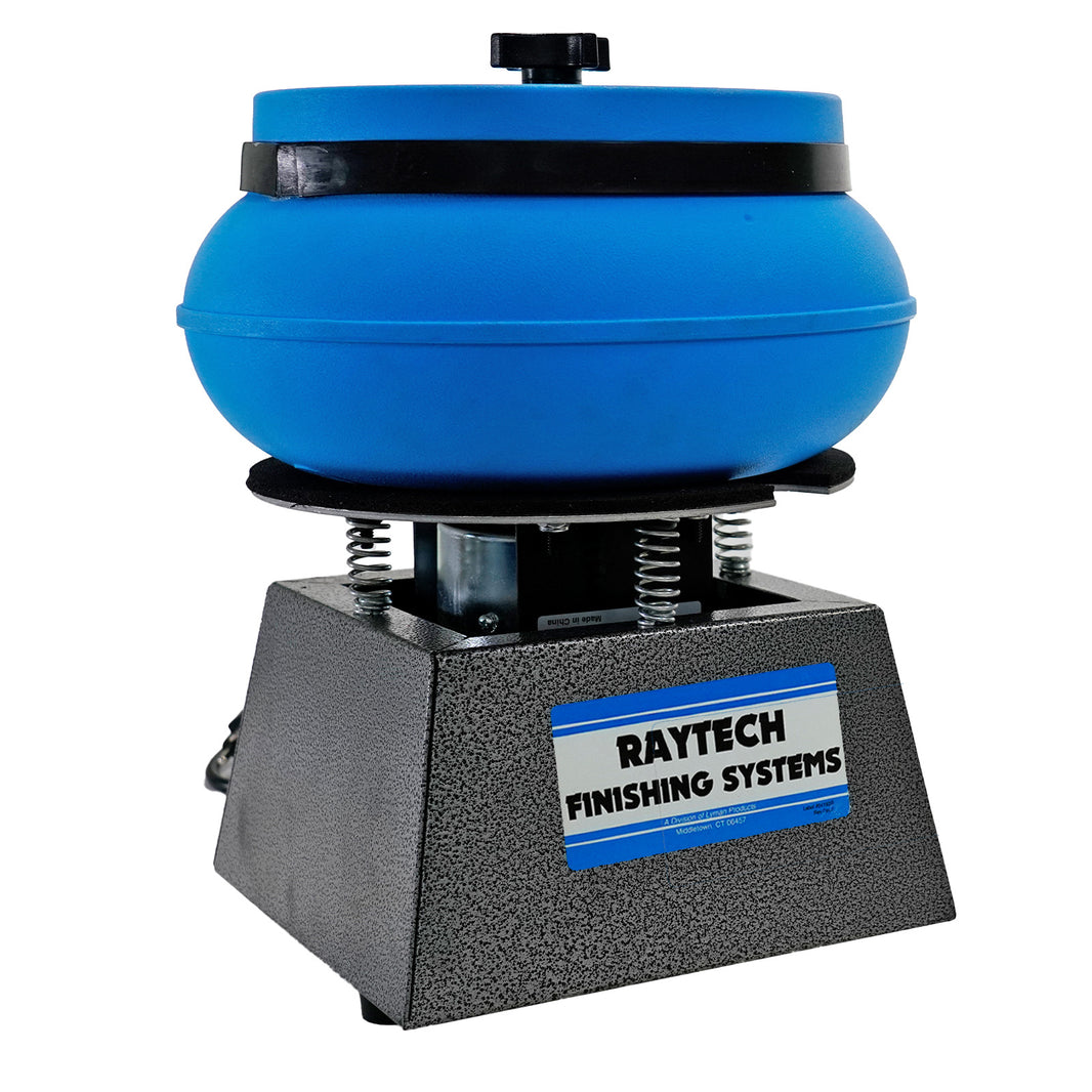 A Raytech Finishing Systems tumbling machine with a blue circular abrasive head mounted on a textured gray base, shown against a plain white background.
