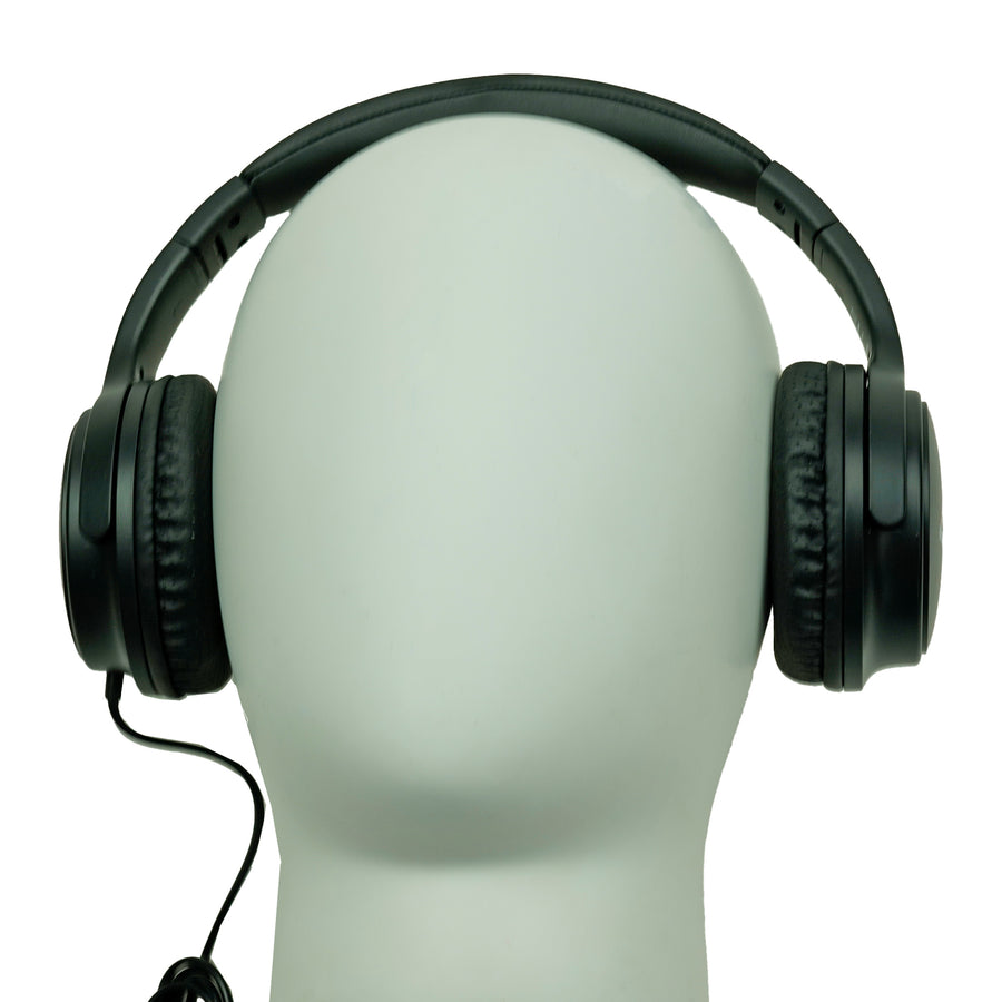 Black over-ear wired headphones displayed on a white mannequin head, with  cable.