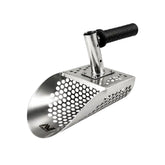 Stainless steel sand scoop position to the right with a black handle and Minelab logo