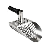 Stainless steel sand scoop position to the left with a black handle and Minelab logo