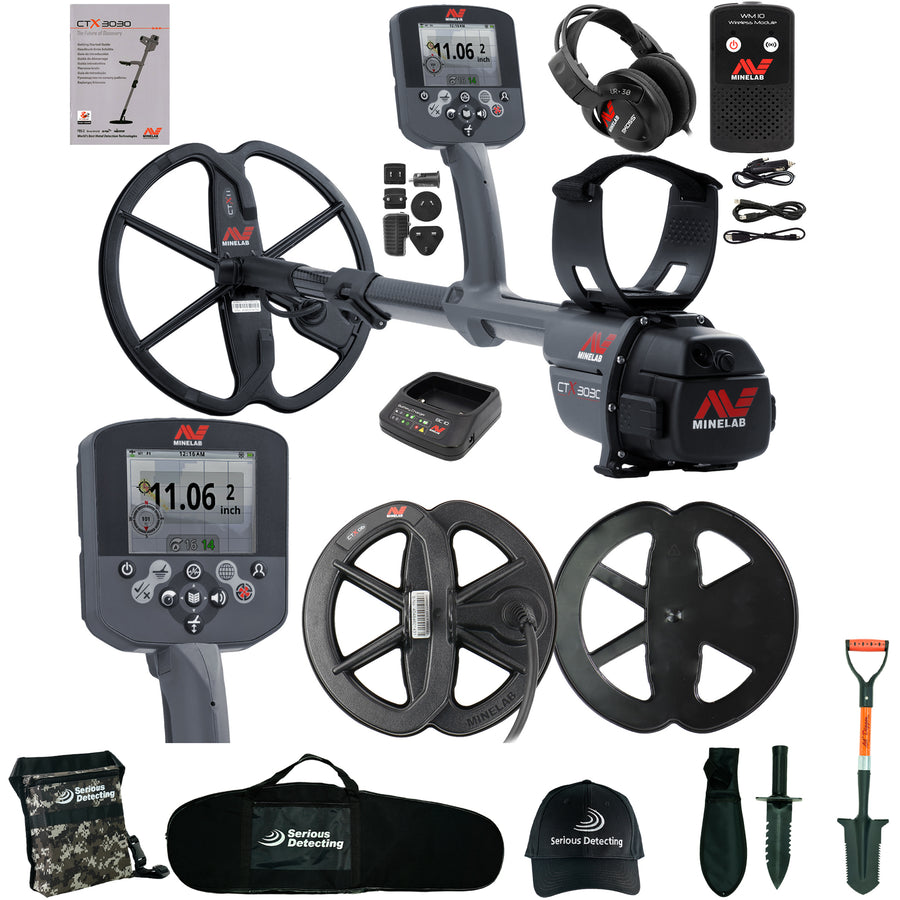 A metal detector kit laid out on a white background, including a gray and black Minelab metal detector with two coils, a control box, headphones, a battery charger, cables, a carrying case, a cap, gloves, a shovel, and other accessories. The Minelab brand and Serous Detecting brand is clearly visible on multiple items.