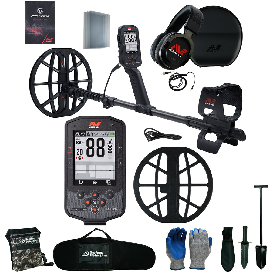 A metal detector kit laid out on a white background, including a black metal detector with a large coil and control box, over-ear headphones, carrying case, ground coil, gloves, shovel, brush remover, and accessories. The detector and accessories show the visible brand name 'Serious Detecting'.