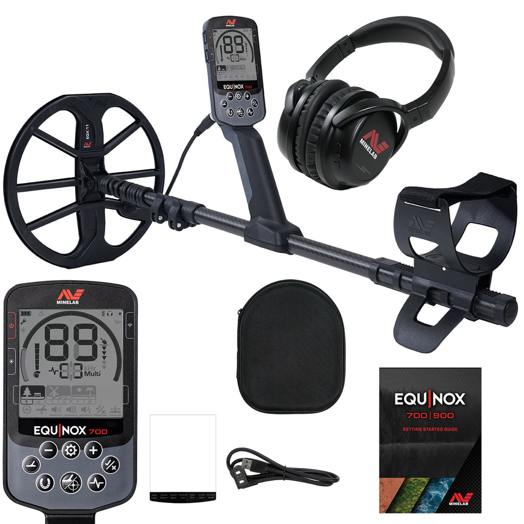 Open box product image of Minelab EQUINOX 700 Multi-IQ Metal Detector with 11-inch coil, including accessories such as headphones, screen protector, charging cable, and getting started guide.