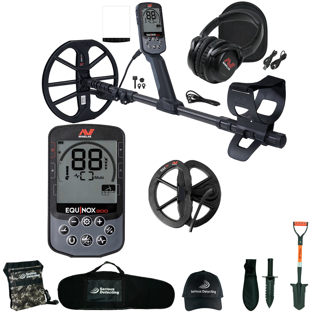 Minelab Equinox black metal detector with headphones, coil,  control box, and detecting kit on white background