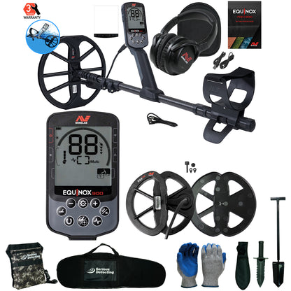Equinox Nox 900 metal detector kit with a black control unit, dual coils, headphones, gloves, shovel, and carrying bag on a white background.