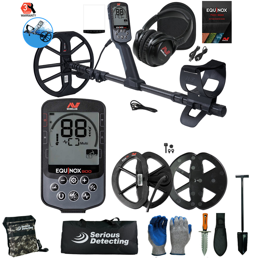 Equinox 900 metal detector kit with a black control unit, large black coil, headphones, carrying bag, gloves, shovel, and accessories on a white background.