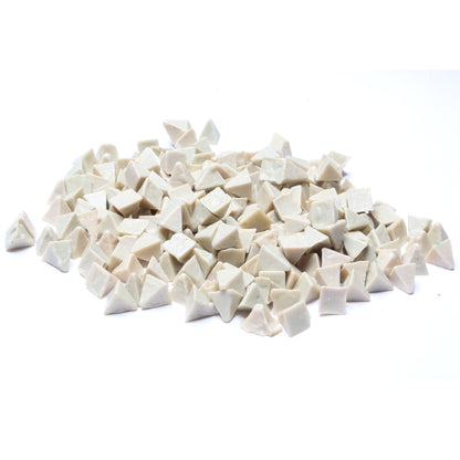 Close-up view of Raytech white ceramic pyramid media pieces for vibratory tumblers