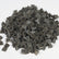 Raytech grey brown pyramid tumbling media showing angular pyramid-shaped pieces