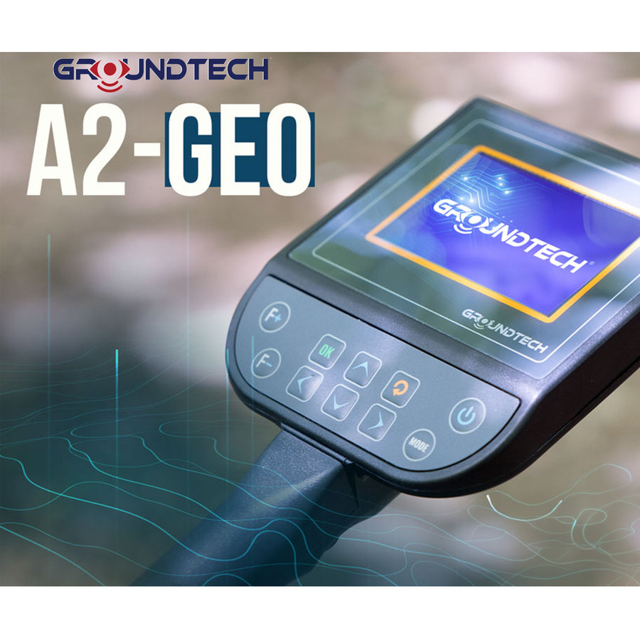 Groundtech A2-GEO handheld metal detector control unit with a digital display screen and touch buttons, shown against a blurred outdoor background with graphic wave overlays and product branding text.