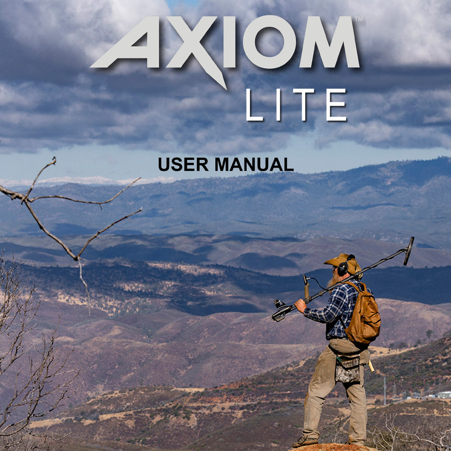 Axiom Lite User Manual cover featuring a man with a metal detector standing on a mountain ridge with a vast mountain range and cloudy sky in the background.