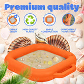 An orange inflatable sand shifter with integrated handles, shown filled with sand and surrounded by seashells on a light beige background. The image includes marketing text reading 'Premium quality' and four feature icons for unique design, high quality plastic, simple construction, and comfortable hand strap.