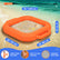 An inflatable orange beach sand pit with a wrist strap, shown on a sandy beach with ocean water in the background. White dotted lines and blue measurement labels indicate dimensions: 51 inches (130 cm) in length, 22 inches (57 cm) in width, and 18 inches (46 cm) in depth.