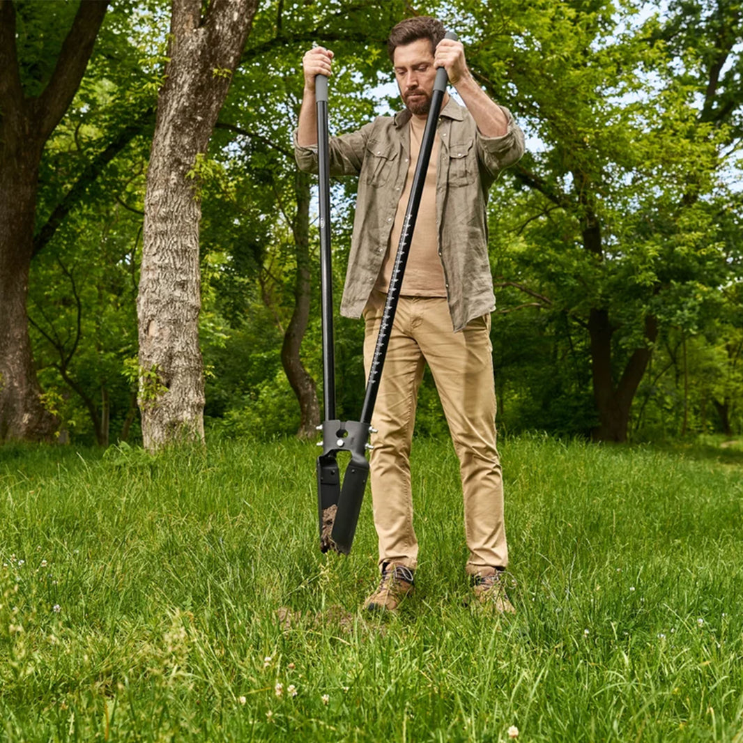Man using the CKG Heavy Duty Post Hole Digger with clam shell end closed holding dirt