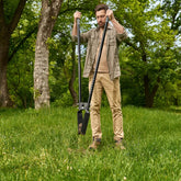 Man using the CKG Heavy Duty Post Hole Digger with clam shell end closed holding dirt