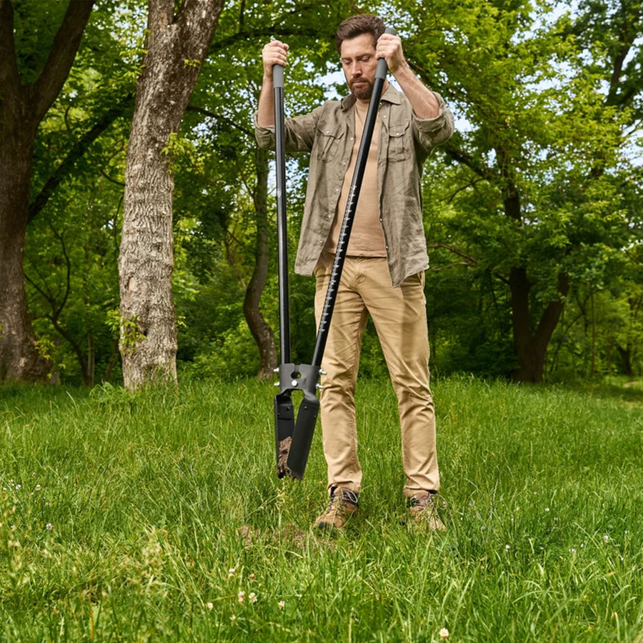 Man using the CKG Heavy Duty Post Hole Digger with clam shell end closed holding dirt