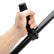 Hand holding a black pull handle against a white background