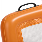 Close-up of an orange floating beach sifter upright with a black handle on a white background