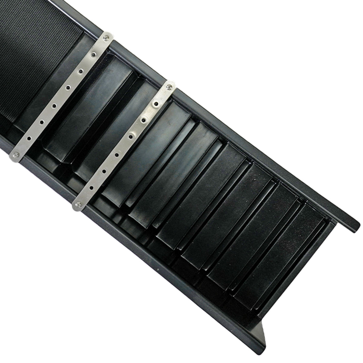 A close-up of a black plastic sluice box with two silver metal mounting straps fastened across it, shown on a plain white background.