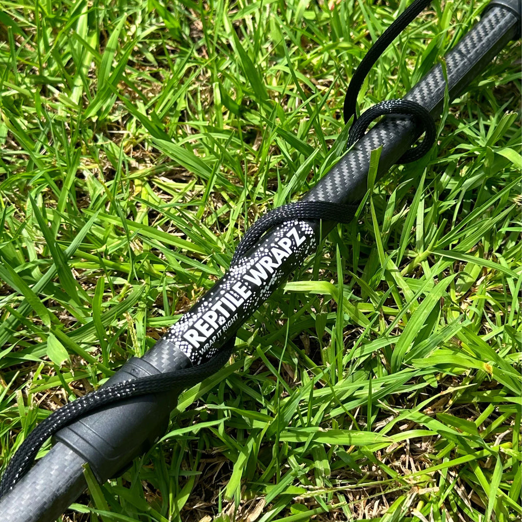 Black Reptile Wrapz coil sleeve installed on metal detector wire close-up view