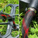 Red Reptile Wrapz coil sleeve installed on metal detector wire close-up view