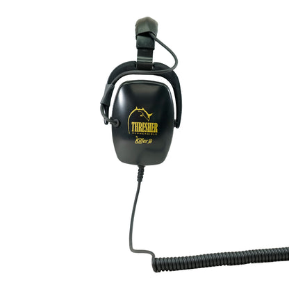 Black headphones positioned to the side with yellow "Killer B Thresher SUBMERSIBLE" writing in yellow with black coiled cord with white background