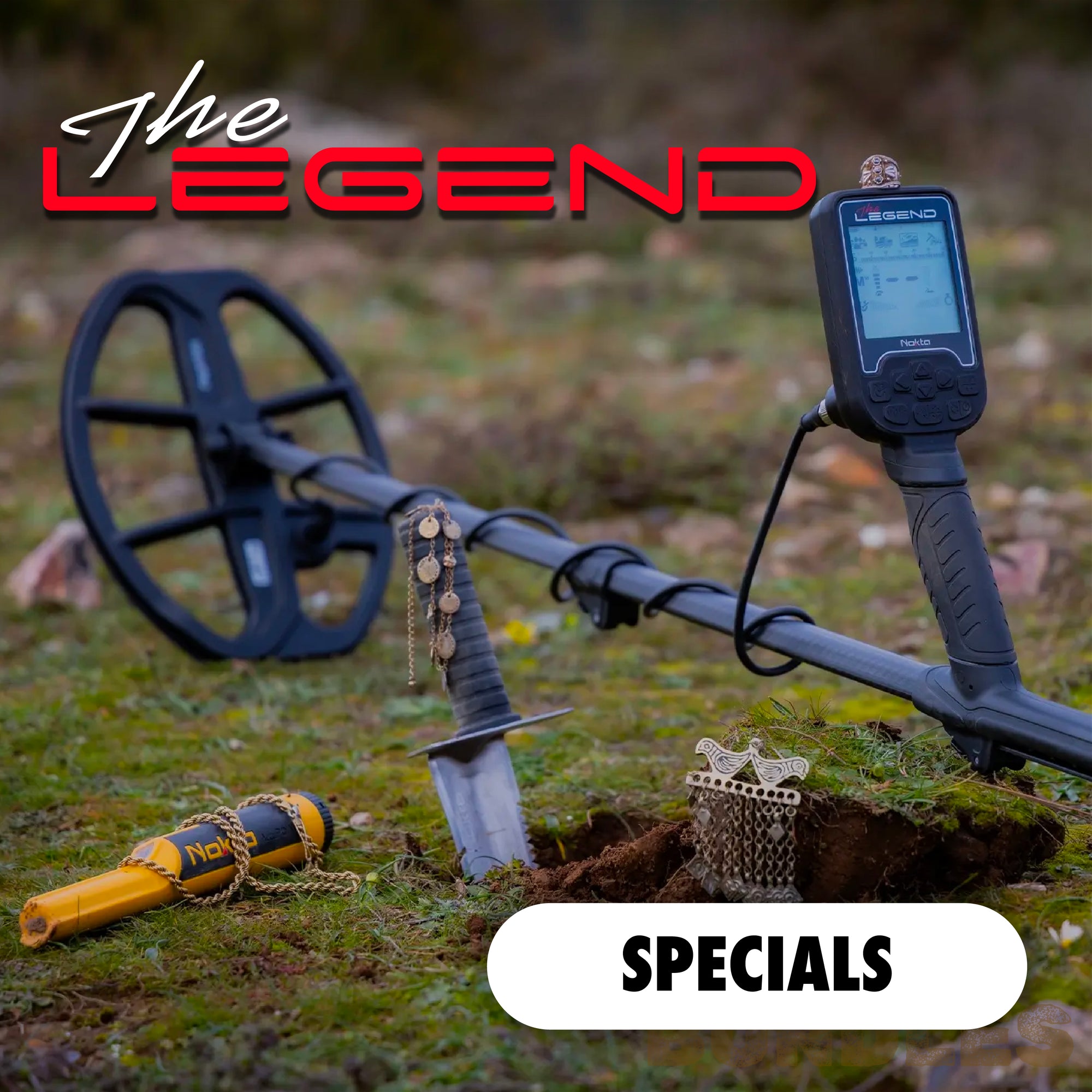 Metal detector with finds on grass, branded 'The Legend', with 'SPECIALS' text.