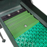 Green textured mat with perforated design with rubber dream mat inside highbanker Sluice on a white background