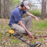 Detectorist recovering a target in the field with the Pro-Pointer AT Z-Lynk
