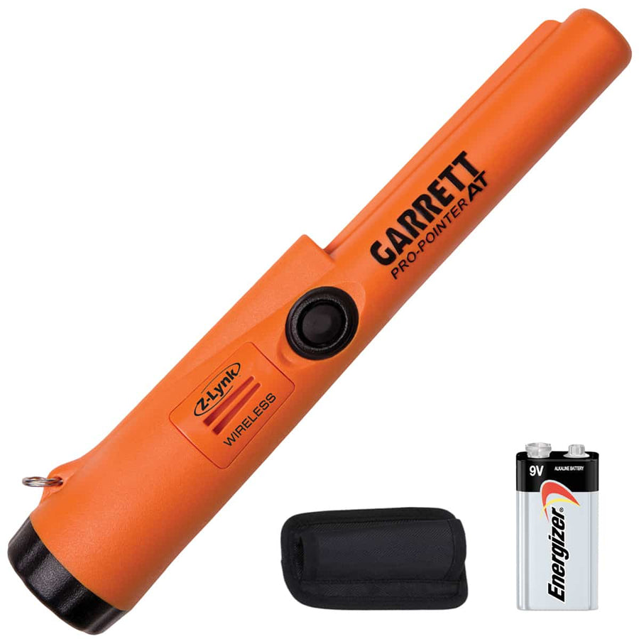 Orange Garrett Pro-Pointer AT metal detector with a battery and carrying case on a white background