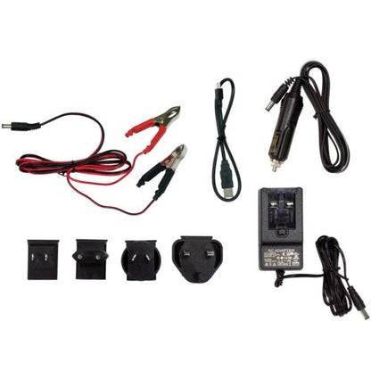 Minelab GPZ 7000 charging kit with 12V adaptor, 240V adaptor, USB wireless audio cable, and vehicle crocodile clip cable on white background
