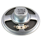 Close-up view of White's 4 ohm speaker showing paper cone construction and mounting