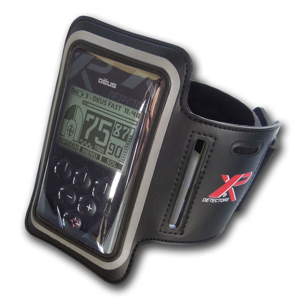 XP Deus metal detector remote control in black armband case with display screen visible
