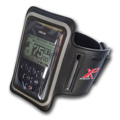 XP Deus metal detector remote control in black armband case with display screen visible
