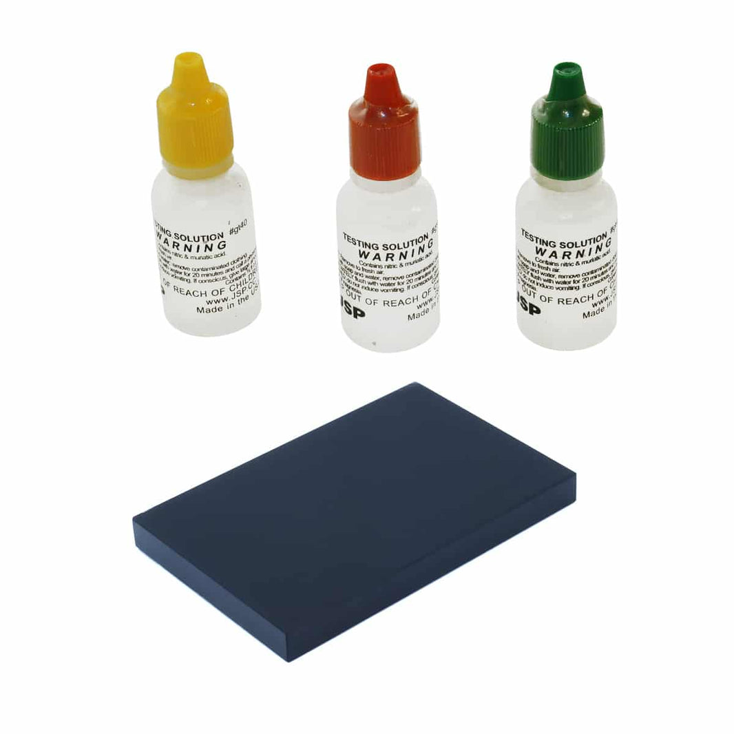 Complete gold testing kit with three acid bottles and black test stone
