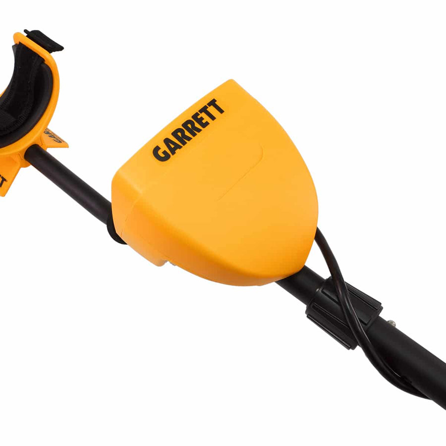 The yellow replacement Battery Cover for the Garrett ACE series Metal Detectors is shown attached to the control pod.  