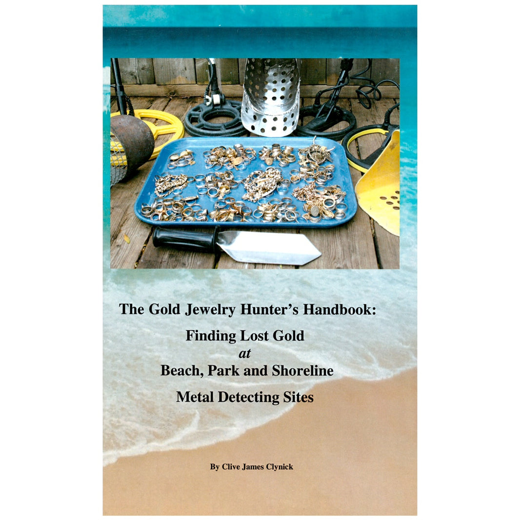 Book cover of 'The Gold Jewelry Hunter's Handbook' with metal detecting equipment and jewelry on a beach.