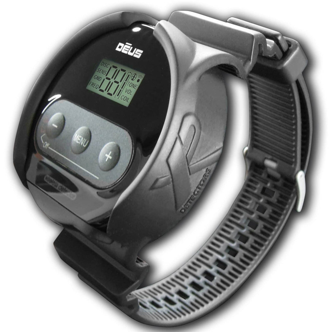 XP Deus silicone wristband with WS4/WS6 control pod mount, rainproof black and gray construction, adjustable strap with textured grip, LCD display visible